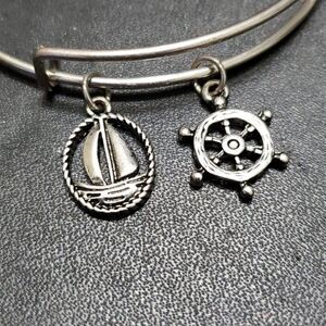 Silver tone sailing themed charm bangle bracelet 7.25"